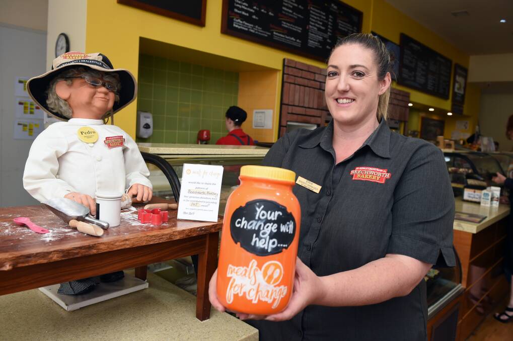 CHANGE: Uniting Ballarat's Meals for Change program will celebrate its third birthday this year. Beechworth Bakery Manager Ellice Frawley holds a donation jar. 