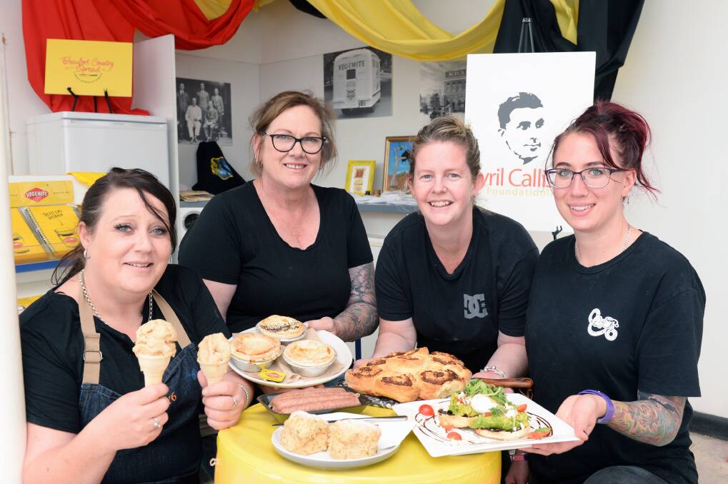 AUSSIE FAVOURITE: Renee Purdy and Michelle Hawkes from Cafe Fifty6, and Eboney Rose and Sammi Beaton from Skinny Sisters Cafe show off the town's Vegemite themed produce. Picture: Kate Healy 