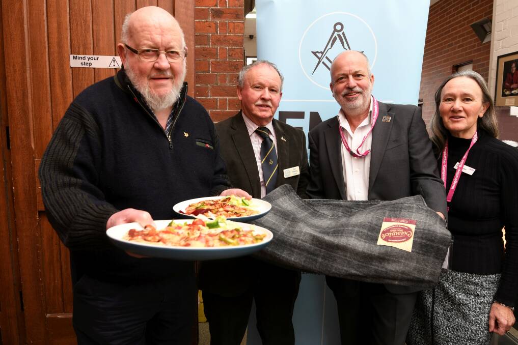 SUPPORT: The Freemasons Foundation's Len Tyzack and Ron Fleming donated blankets and money for food to Uniting chief executive Paul Linossier and Ballarat executive officer Annette Kelly-Egerton. Picture: Lachlan Bence 