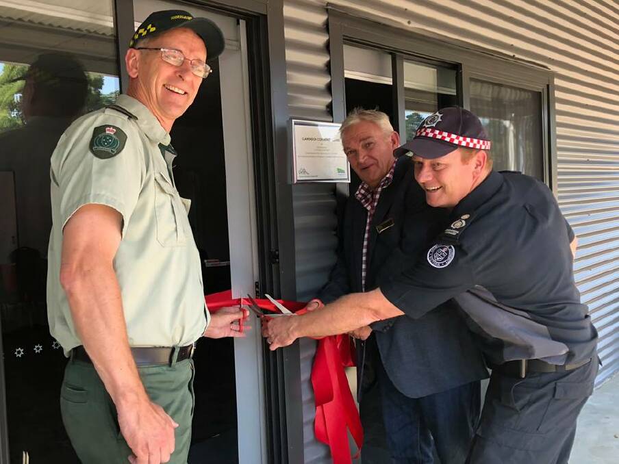 TOGETHER: Jon Rofe from Forest Fire Management Victoria, Moorabool Shire Council mayor Paul Tatchell and CFA District 15 Operations Manager Brett Boatman officially open the Clarendon Community Centre on Saturday. Picture: Moorabool Shire Council 
