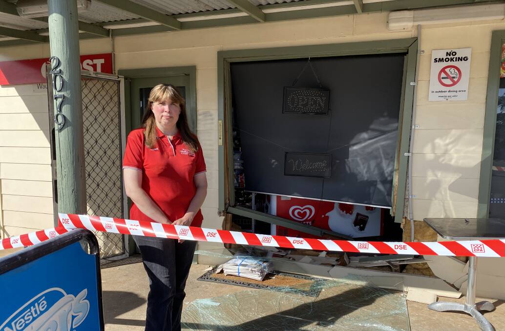 DAMAGE: Karen Hinchliffe in front of where her shop was rammed. 