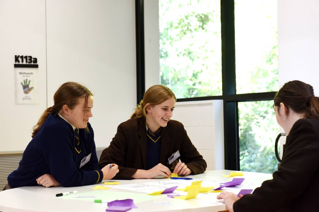 DISCUSSIONS: Ballarat Grammar students Demi Op de Coul, Lila Parr and Skye Wilkins's idea was a virutal reality experience educating on women's safety. 