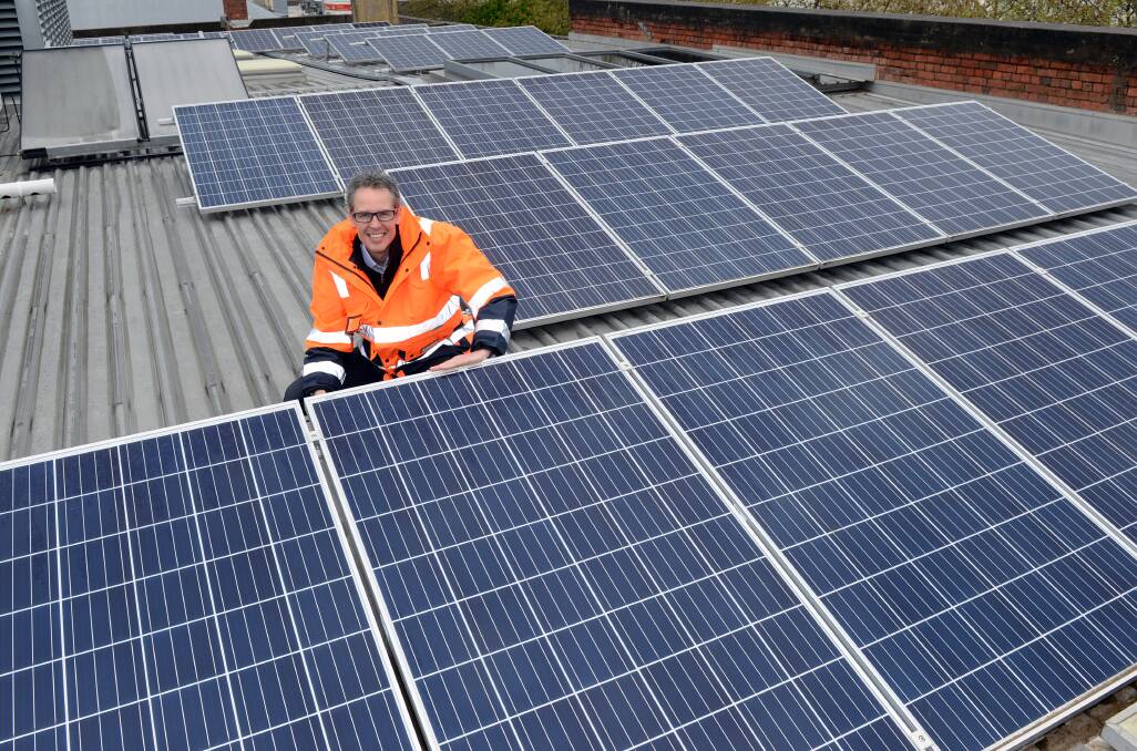 SOLAR: Councillor Ben Taylor with City of Ballarat solar panels on the Phoenix Building. Picture: Kate Healy 