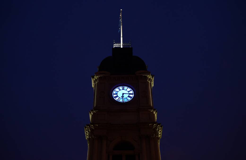 LOSS: Ballarat Town Hall was lit up in blue colour on Thursday night as a show of respect to Victoria Police. Pictures: Adam Trafford 