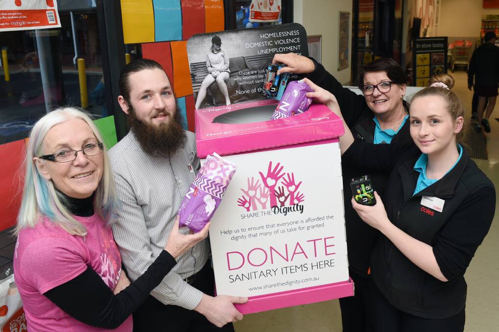 SUPPORT: Volunteer Andrea Whimpenny, and Coles staff Hayden Etcheberry, Janet Glasson and Ashleigh Conder are sharing the dignity. Picture: Kate Healy