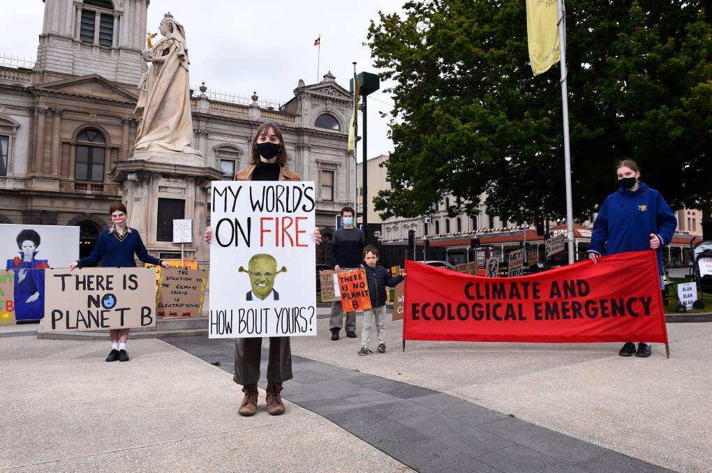 LOUD AND CLEAR: Kitty Wills, Hazel Lanyon, Ryan Anderson, Oscar and Olive Lanyon in a climate demonstration on Monday. Picture: Adam Trafford 