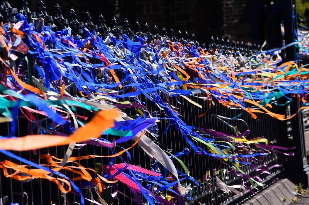 SUPPORT: Loud ribbons on fence of St Patricks Cathedral in Ballarat. The model will be followed at St Kilda Football Club and nearby schools. Picture: Adam Trafford 