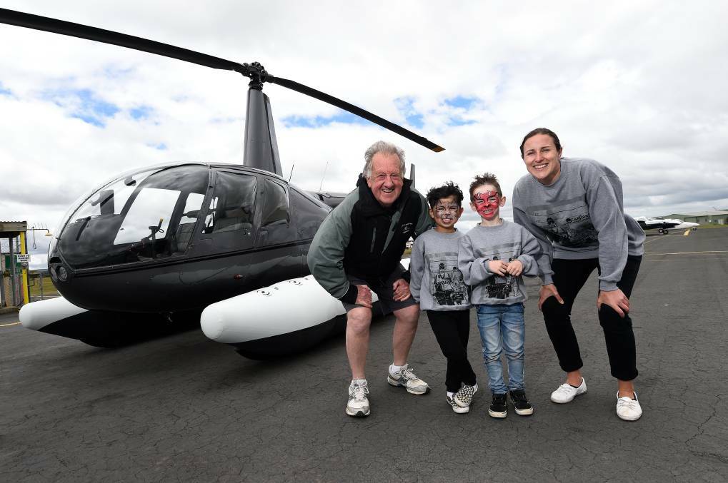 FUN: Co-founder Cops N Kids John Moloney, Jacob and Zac and Challenge Camp Co-ordinator Sarah Legg at the Ballarat Airport during the 2019 camp. Picture: Adam Trafford
