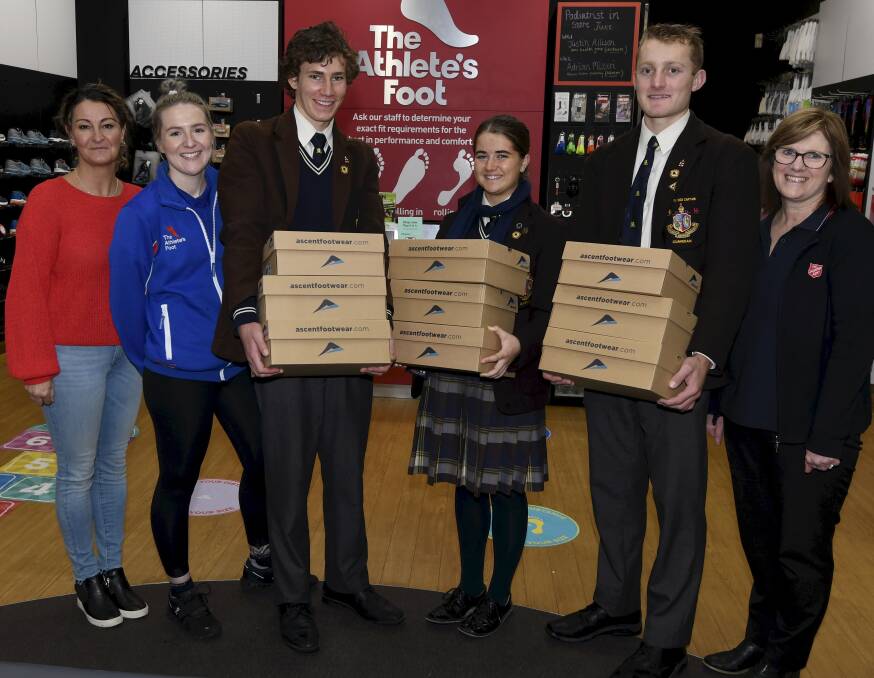 GIFT: Salvation Army homelessness Ballarat Manager Kellie Brown, Athlete's Foot store manager Bec Wallis, Ballarat Grammar students Henry Tickner, Ruby Riordan, Sam Breuer and Salvation Army homelessness Chaplain Fiona White. Picture: Lachlan Bence 