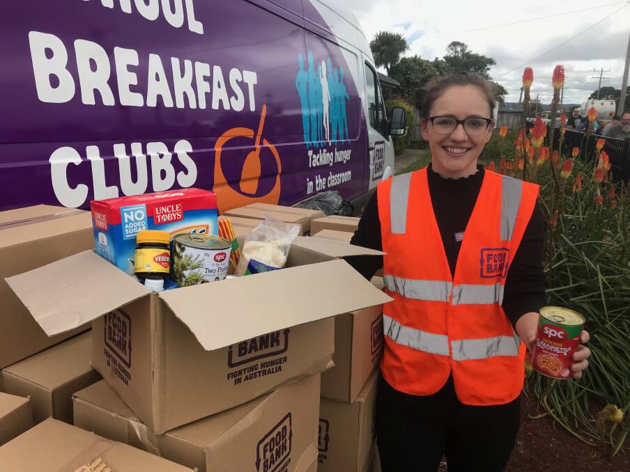 GIFT: Mikaela Figgis, fundraising coordinator Foodbank hands out special hampers for Christmas. 