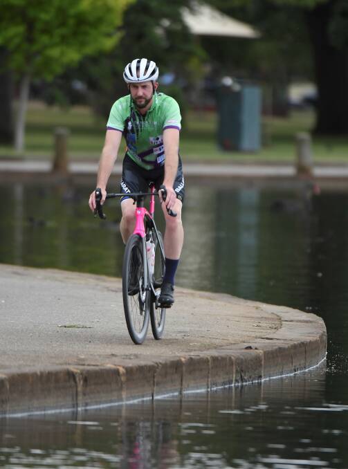 CONVERSATION STARTER: Ballarat rider Andrew Huie's hot pink bike grabs attention, helping to raise awareness of cancer and cancer research. Picture: Lachlan Bence 