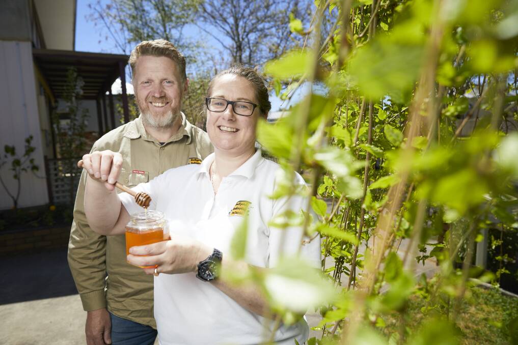 PURE: Scott Denno and Amanda Collins sell their honey in Ballarat. Pictures: Luka Kauzlaric