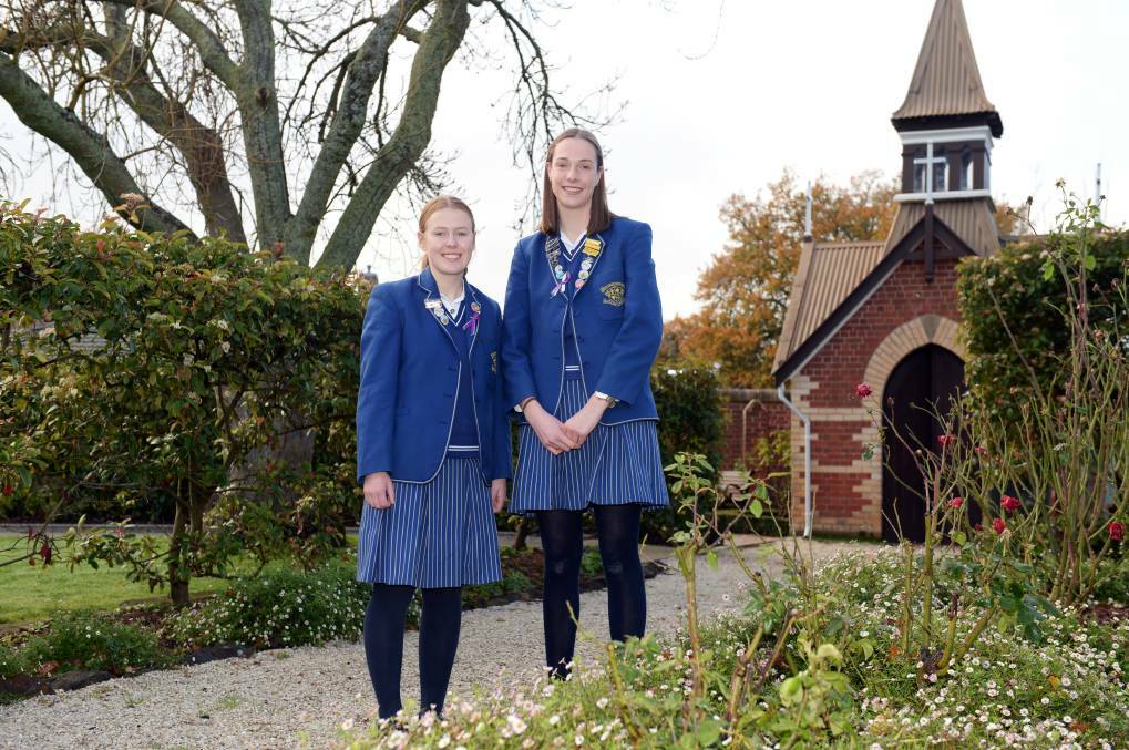 RECOGNISE: Year 12 Loreto College students Eliza McCrum and Chloe Stevens worked on the project team to collate stories of young people's acts of kindness. Picture: Kate Healy 