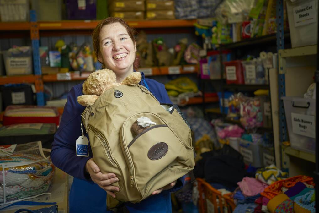 SUPPORT: Eureka Mums volunteer Fiona Smith says each donated toy needs testing, meaning each teddy needs cuddling before being packed as a gift. Picture: Luka Kauzlaric