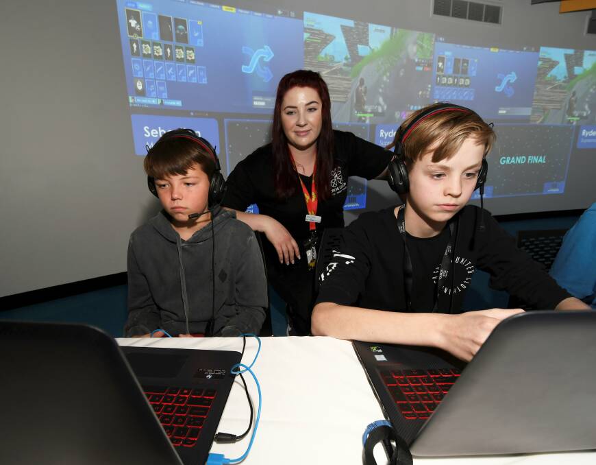 GAME ON: Students Luke and Kobie compete at the school eSports tournament at the Ballarat Tech School on Friday run by program facilitator and Dark Shadow Studio CEO Casey Thomas. Picture: Lachlan Bence 