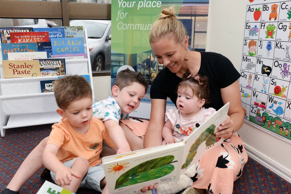 LITERACY: Charlie Moroney, 2, Mason Moroney, 4, Ricci McGreevy and Daisy Moroney, 10mths develop a love of reading together. Pictures: Kate Healy 