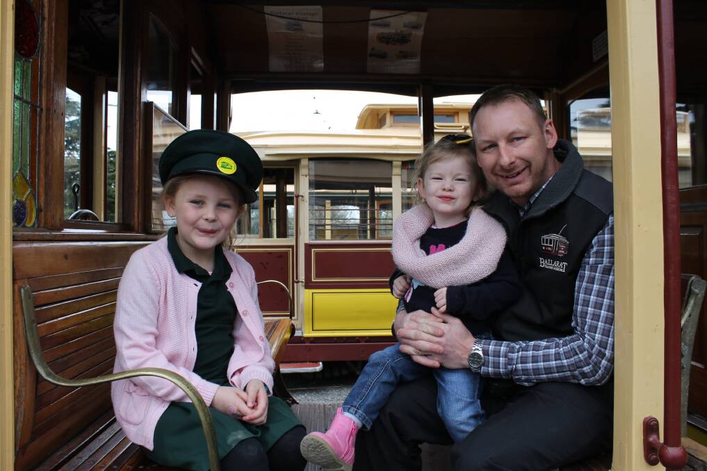 TRAM ENTHUSIASTS: Ballarat Tramway Museum members Alice, 7, Ruby, 2 and their father Paul Mong, president, are helping to preserve Ballarat's history for future generations. Picture: Rochelle Kirkham 