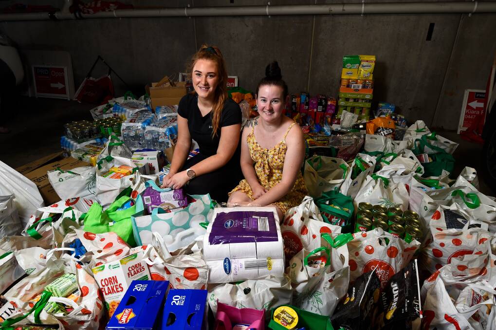 GIVING COMMUNITY: PRDnationwide Ballarat sales consultant Kiara Porra and donor Tegan Stevenson are overwhelmed at the community's response to a call out for items for bushfire relief. Pictures: Adam Trafford 