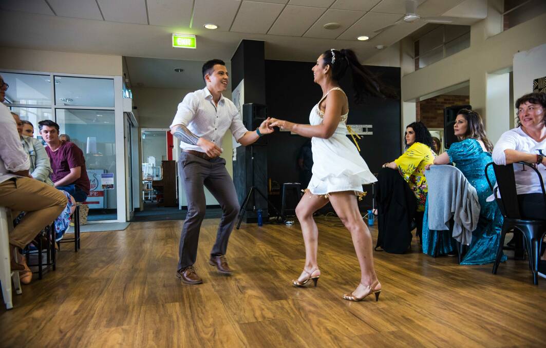 PERFORM: Victor Barrantes and Stefi Tello dance salsa at A Pot Of Courage's Latinoamerica experience night. Picture: Diana Paez