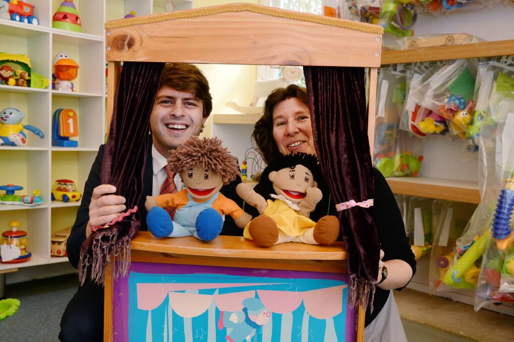 SMILES: It's play time after fundraising effort for Rotary Club of Ballarat Young Ambition's Dominic Morrison and Ballarat Toy Library's Sally Tuck. Picture: Kate Healy 