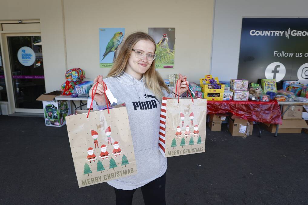 GIVING: Keeley Murphy, founder of charity Keeley's Cause, gifting Christmas packs to disability families. Picture: Luke Hemer 