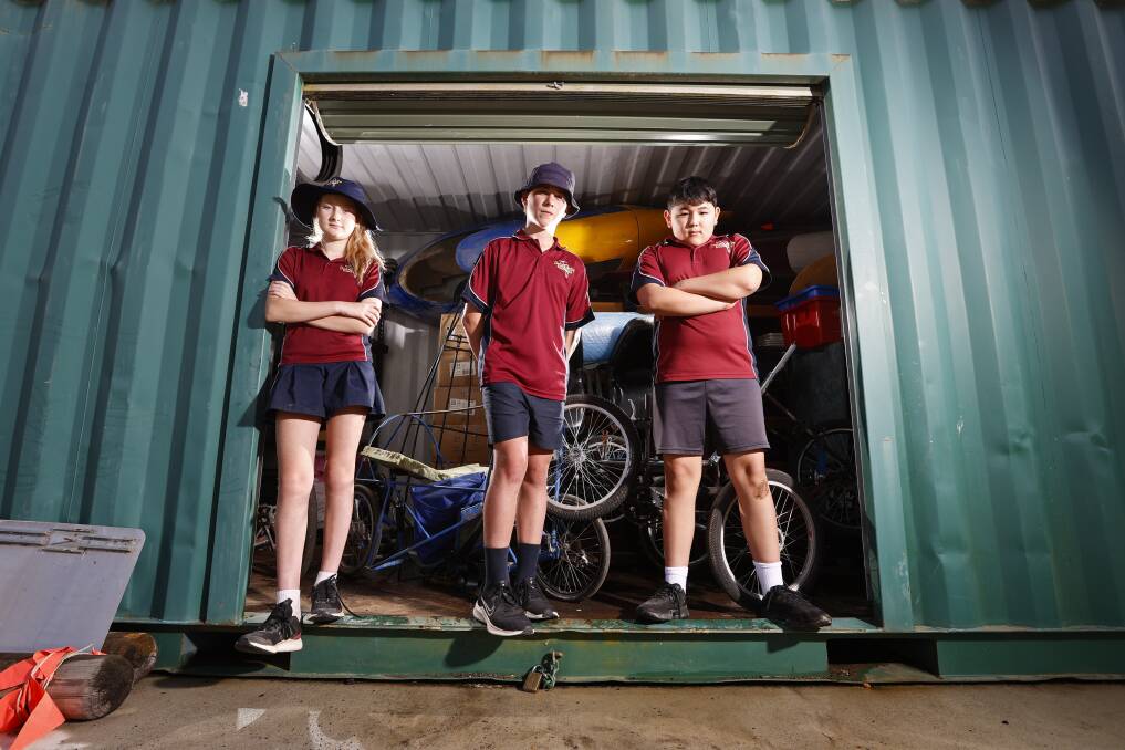ROBBED: Year six students Billy, Chloe and Ben after Delacombe Primary School's storage container and shed was broken into. Picture: Luke Hemer.