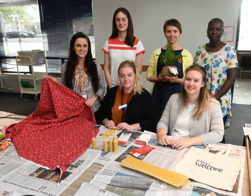 GIRLSPACE: Members Hayley McArthur, Jemmah Powell, Laura Hunt, Karissa Cribbes, Katja Fiedler and Nyibol Deng work together to create handcrafted products for a fundraiser. Picture: Lachlan Bence 