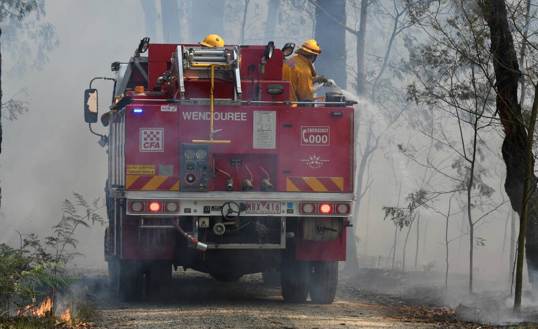 Firefighters battle the Buninyong fire in December. Picture: Lachlan Bence