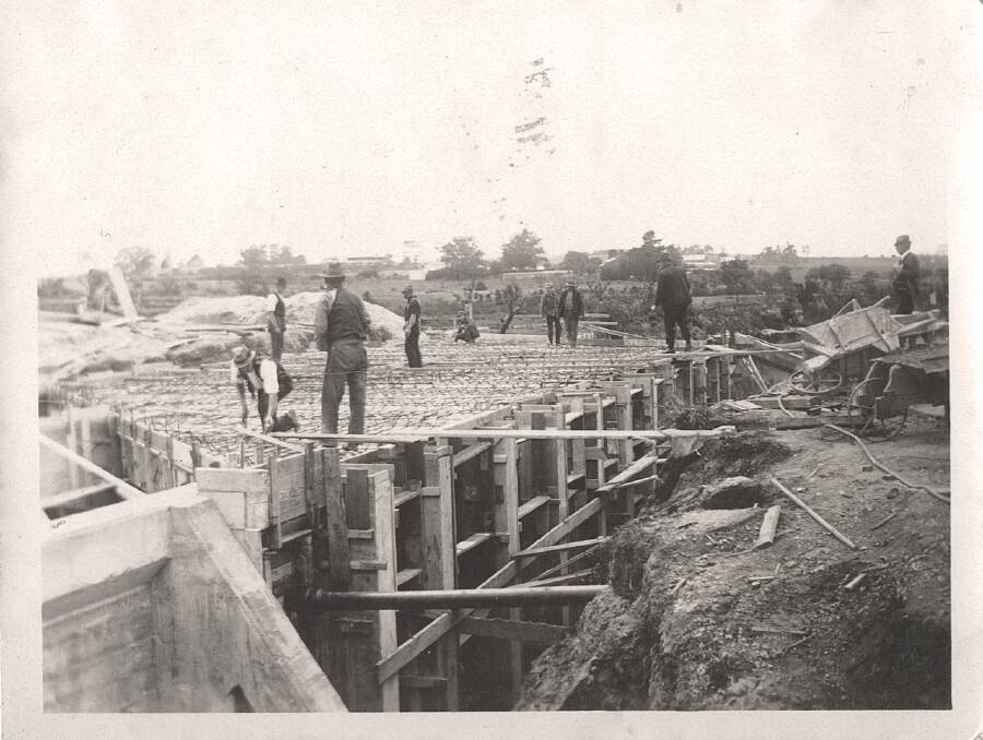 TRADITION: Men worked in jackets and waistcoats constructing the Malvern Bridge over Scotchman's Creek. Picture: Apart from the Roads and the Aqueducts