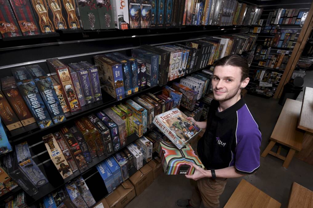 GAME TIME: GUF Games Ballarat is seeing a huge surge in sales of board games online. Staff like Caleb Tong are working to keep up with demand. Picture Lachlan Bence
