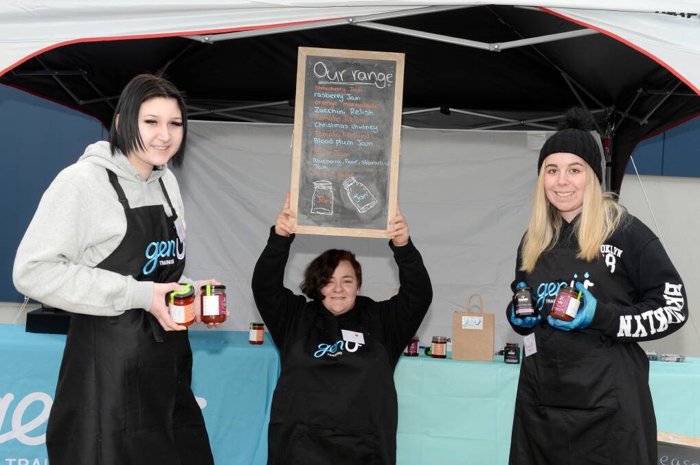 SELL OUT: Berry Street School VCAL students Alara, Rachael and Kiara promote their pop-up shop. 