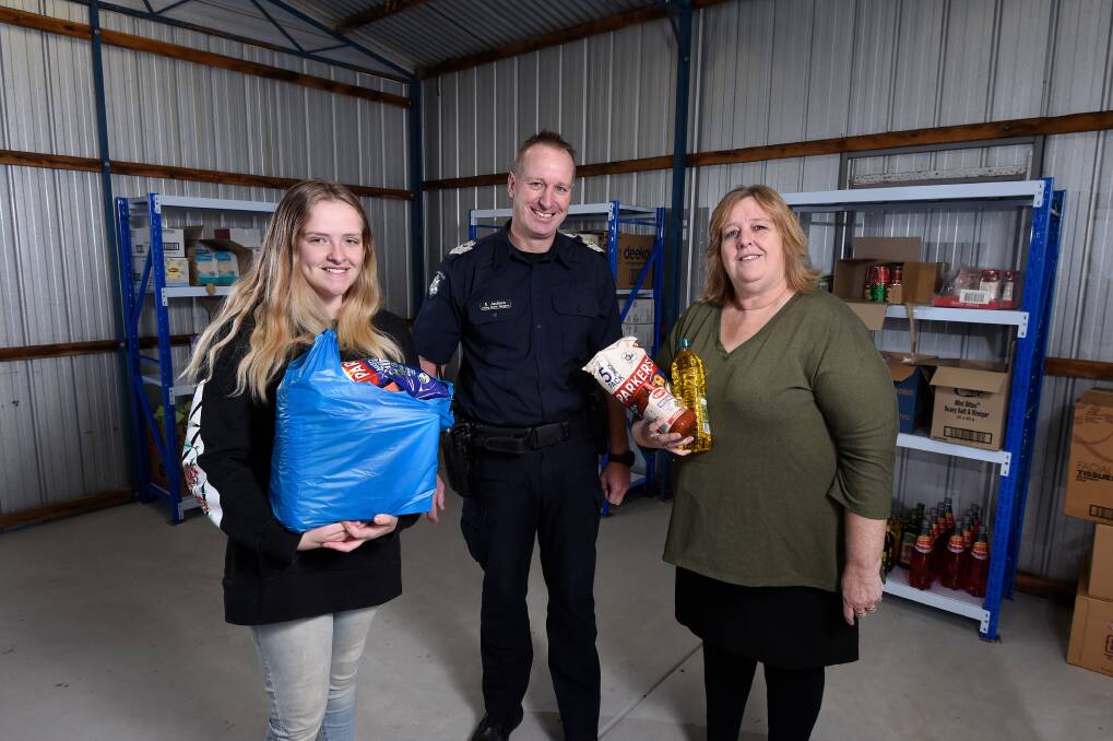GIVING: Keeley's Cause founder Keeley Murphy and director Sharon Murphy with Sergeant Euan Jackson from Ballan Police Station. Picture: Adam Trafford 
