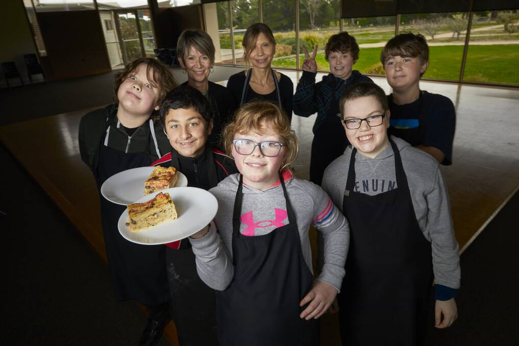 REPURPOSE: Ballarat Specialist School hospitality program manager Deb Agnew, chef Michelle Hastings and pupils Sebbie, Hayley, Joey, Dylan and Chase prepare bread and butter pudding. Picture: Luka Kauzlaric 