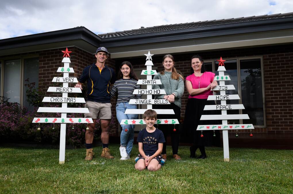 CREATIVITY: Ned and Emma Baldwin with kids Lucy, Millie and Billy have been making Christmas trees. Picture: Adam Trafford 