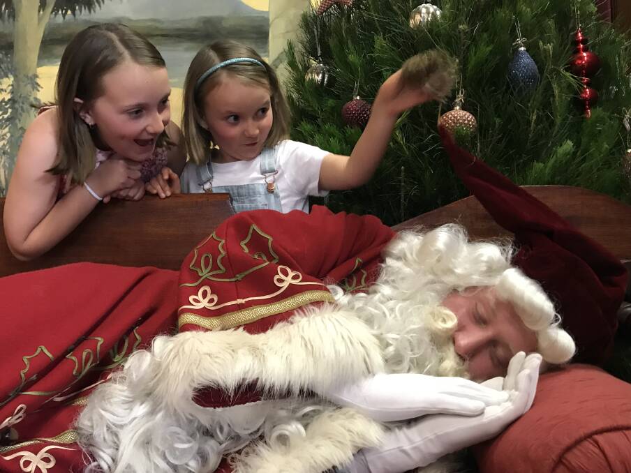 CHRISTMAS SPIRIT: Families and children, like Polly Dawson and Lyla Dawson, can have their photo with St Nicholas at Sovereign Hill during the Christmas Shopping Night on Friday. Picture: Supplied 