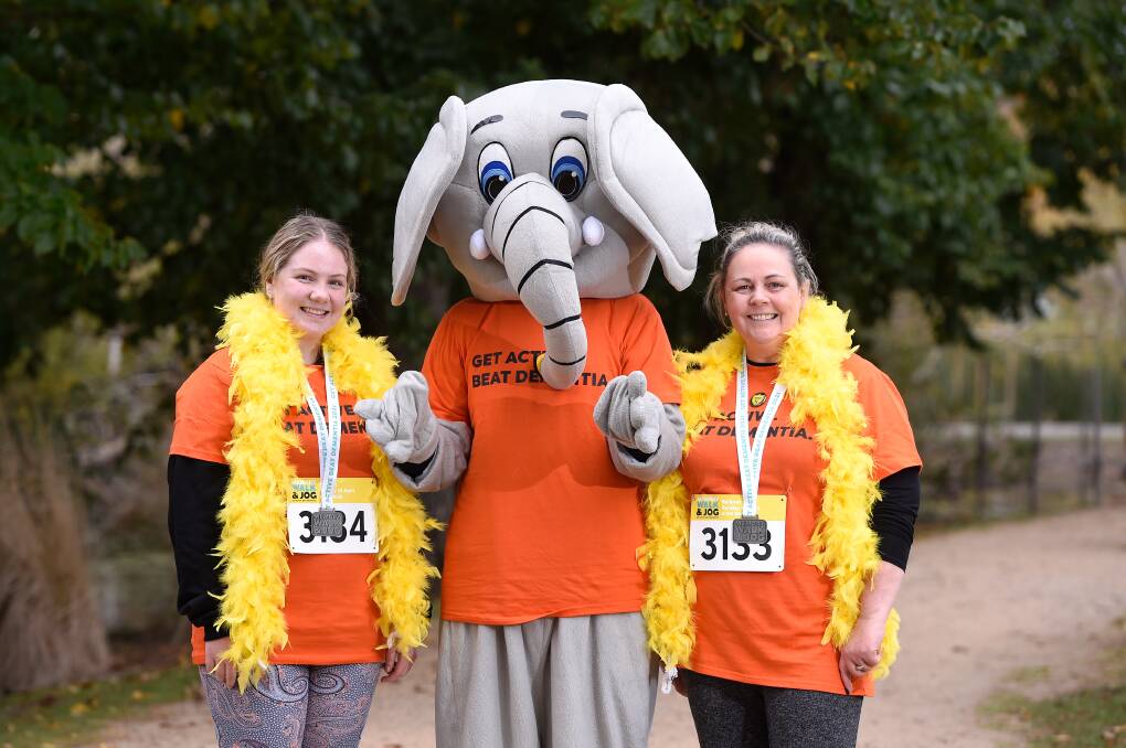 COMMUNITY: Daughter and mother Chase and Wendy Hamilton with Dementia Australia mascot Al the elephant on Sunday. Picture: Adam Trafford
