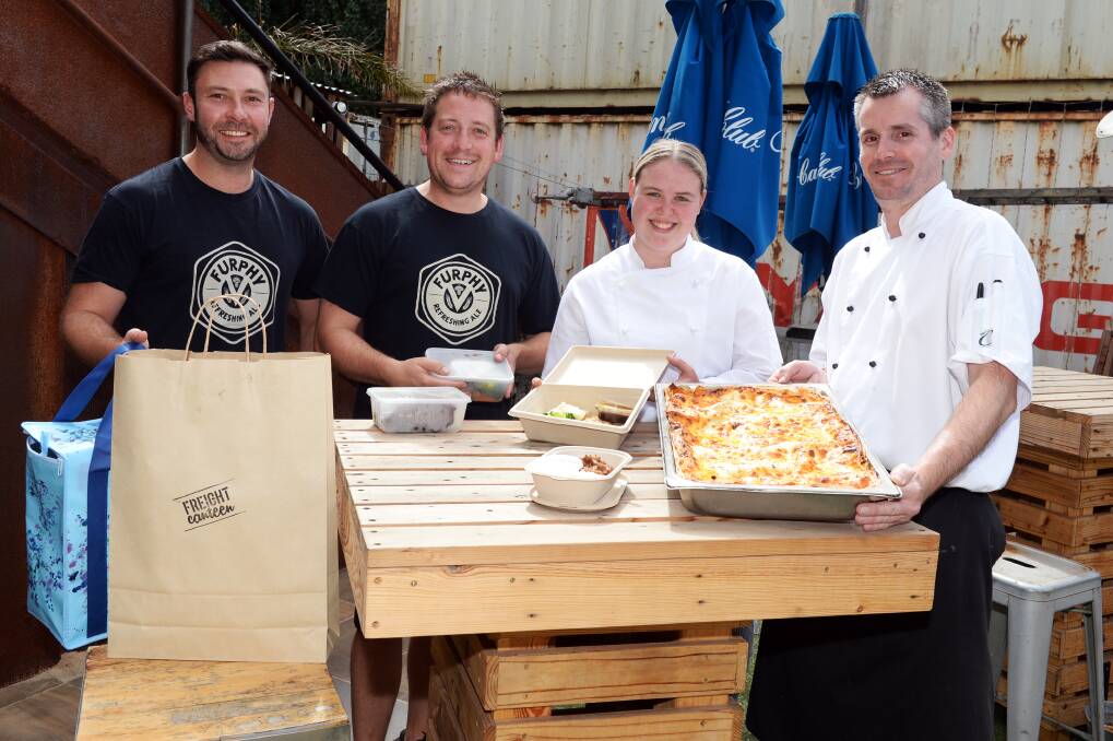ADAPT: Freight owner Chris Sargent, bar manager Nick Haintz, apprentice chef Emily Gilbert and chef Chris Watt. Picture: Kate Healy 