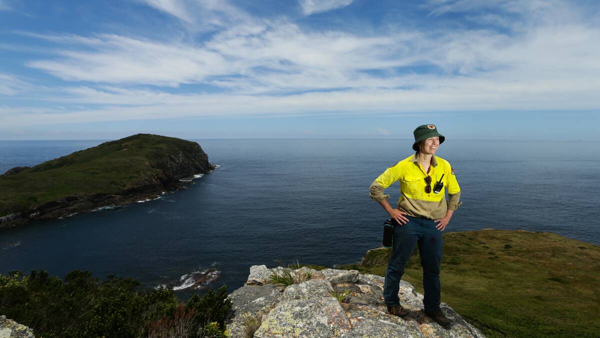 National Parks and Wildlife Service ranger Susanne Callaghan on Pinkatop Head, the highest point on Broughton Island. Picture: Jonathan Carroll
