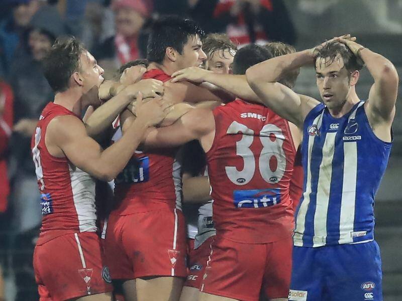 The Sydney Swans dug deep to beat the Kangaroos despite missing their biggest stars in the AFL.