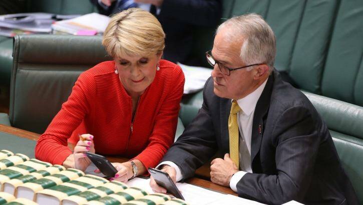 Prime Minister Malcolm Turnbull and Foreign Affairs Minister Julie Bishop  keep abreast of the US election results during question time on Wednesday. Photo: Andrew Meares