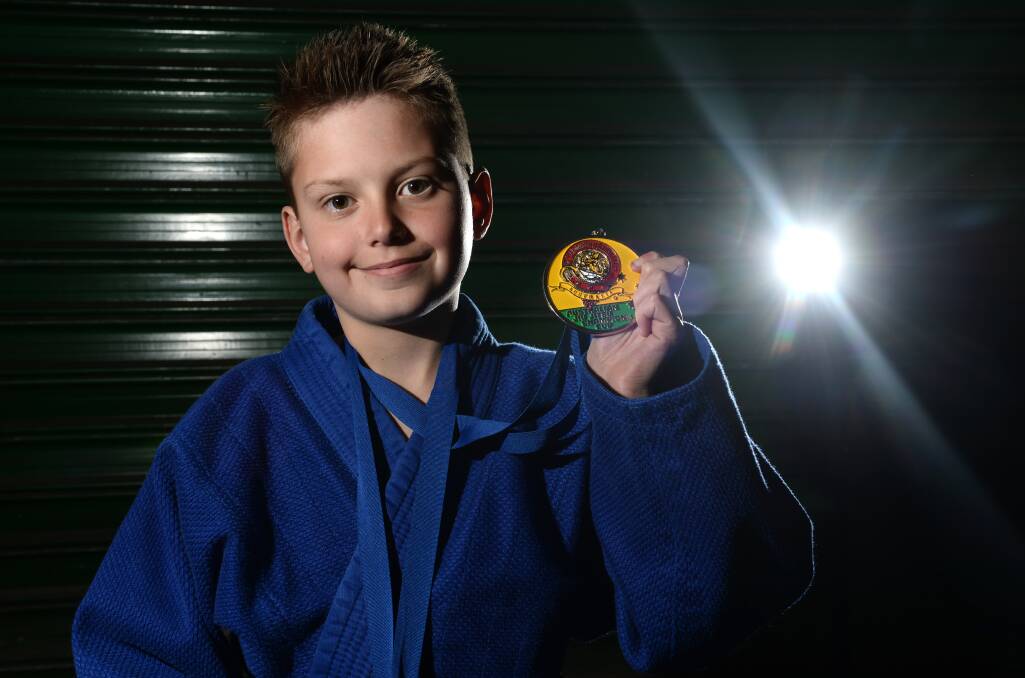 Lachlan Cove with his national Brazilian Jiu Jitsu gold medal.