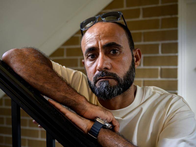 Nahi Al Sharify was arrested and handcuffed by armed AFP officers when his home was raided in error. (Bianca De Marchi/AAP PHOTOS)