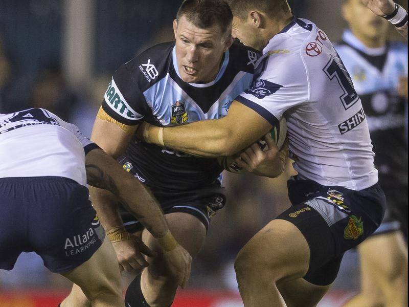 Paul Gallen of the Sharks takes on the North Queensland defence during his side's NRL win.