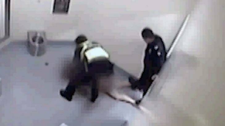 Footage allegedly shows a police officer standing on a woman's legs while she is held in custody at Ballarat police station.
