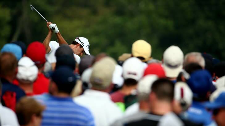 Part of the crowd: Adam Scott of Australia hits his tee shot during the final round of the 96th PGA Championship at Valhalla. Photo: Getty Images