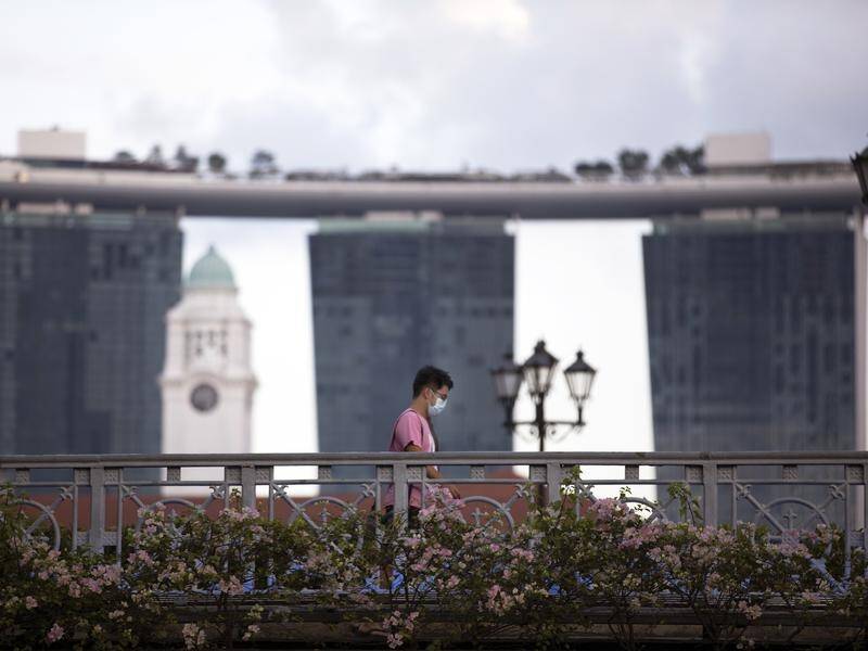 Singapore authorities have tightened restrictions amid a surge in COVID-19 cases.