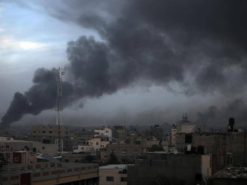Smoke rises from town of Khan Younis after Israeli strikes in its latest attack on southern Gaza. (AP PHOTO)