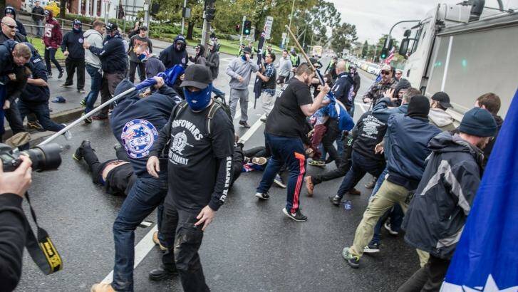 Protesters from rival groups, many wearing masks or balaclavas, fight each other in Coburg. Photo: Mathew Lynn