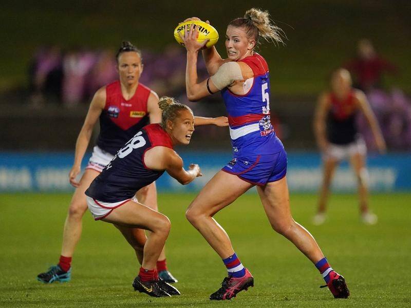 Gabby Newton (r) will miss the AFLW season after undergoing a dual shoulder reconstruction.