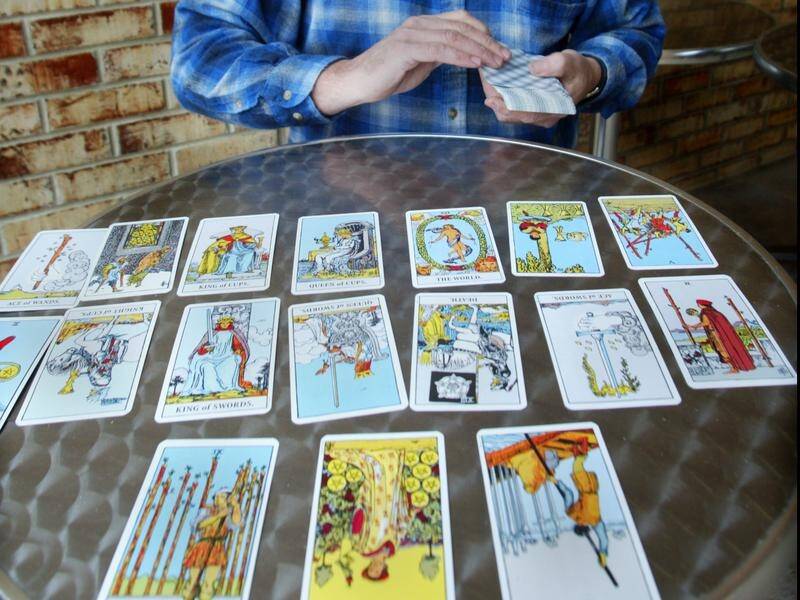 A serial killer has won a court case to keep his tarot cards which feature bare-breasted women.